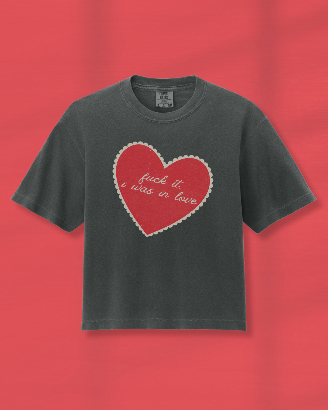 Pepper boxy cropped graphic tee with vintage heart design and ‘fuck it, i was in love’ script, worn relaxed for an effortless look.