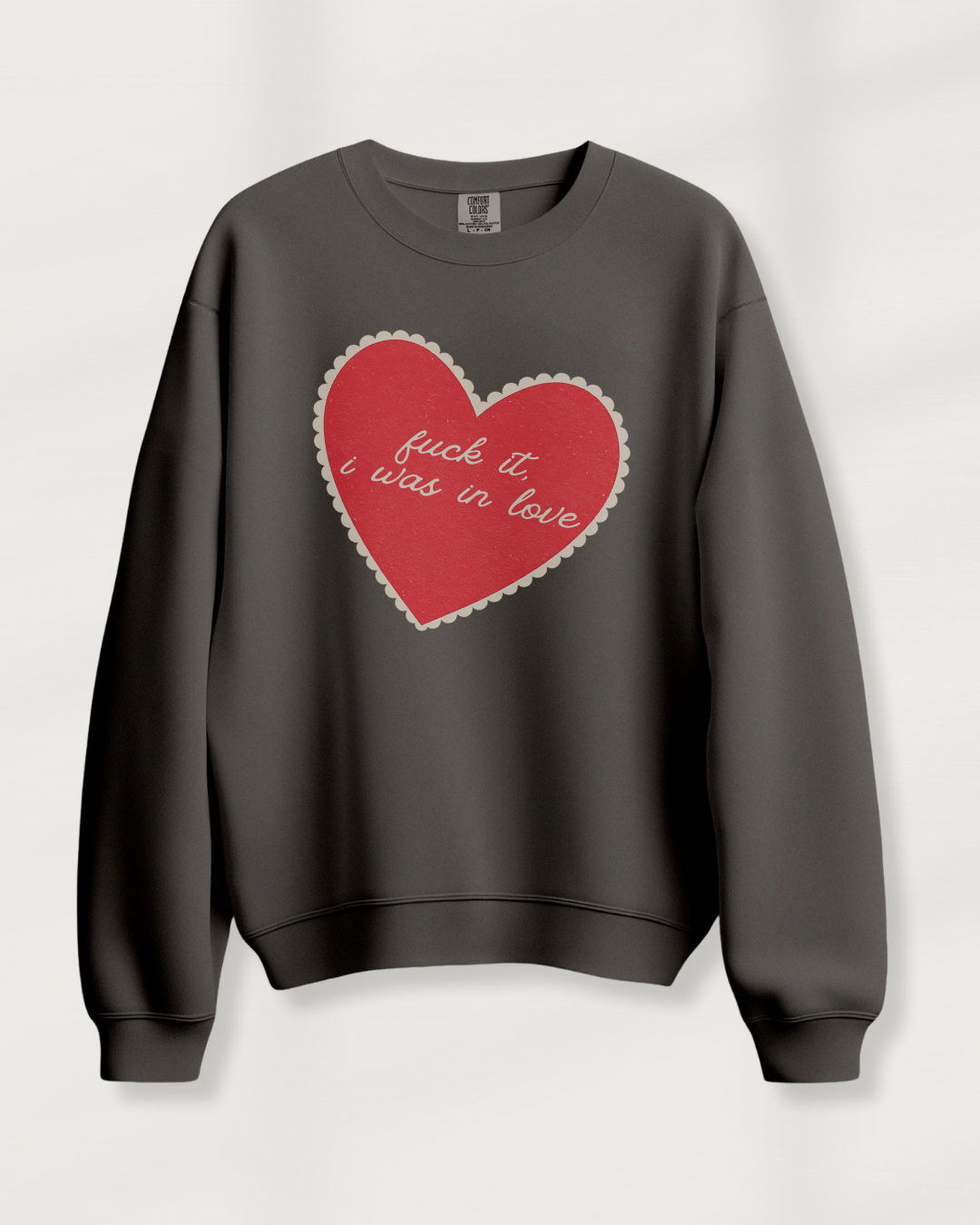 Pepper sweatshirt with vintage heart graphic and “fuck it, i was in love” script, relaxed fit with a worn-in feel.